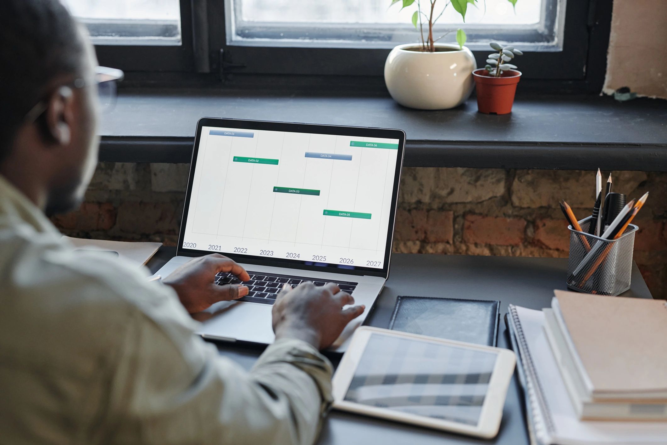 Student working with data on a laptop at a desk