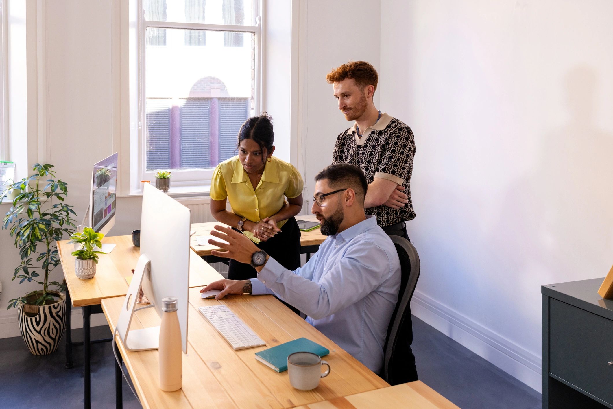 Professional support team collaborating in a modern office