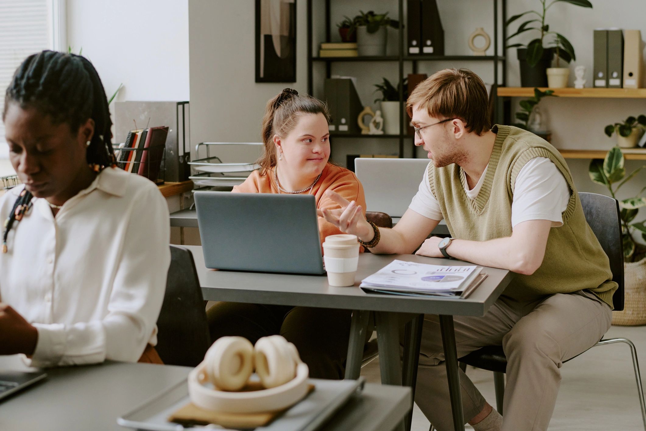 Professional education team collaborating in a modern workspace